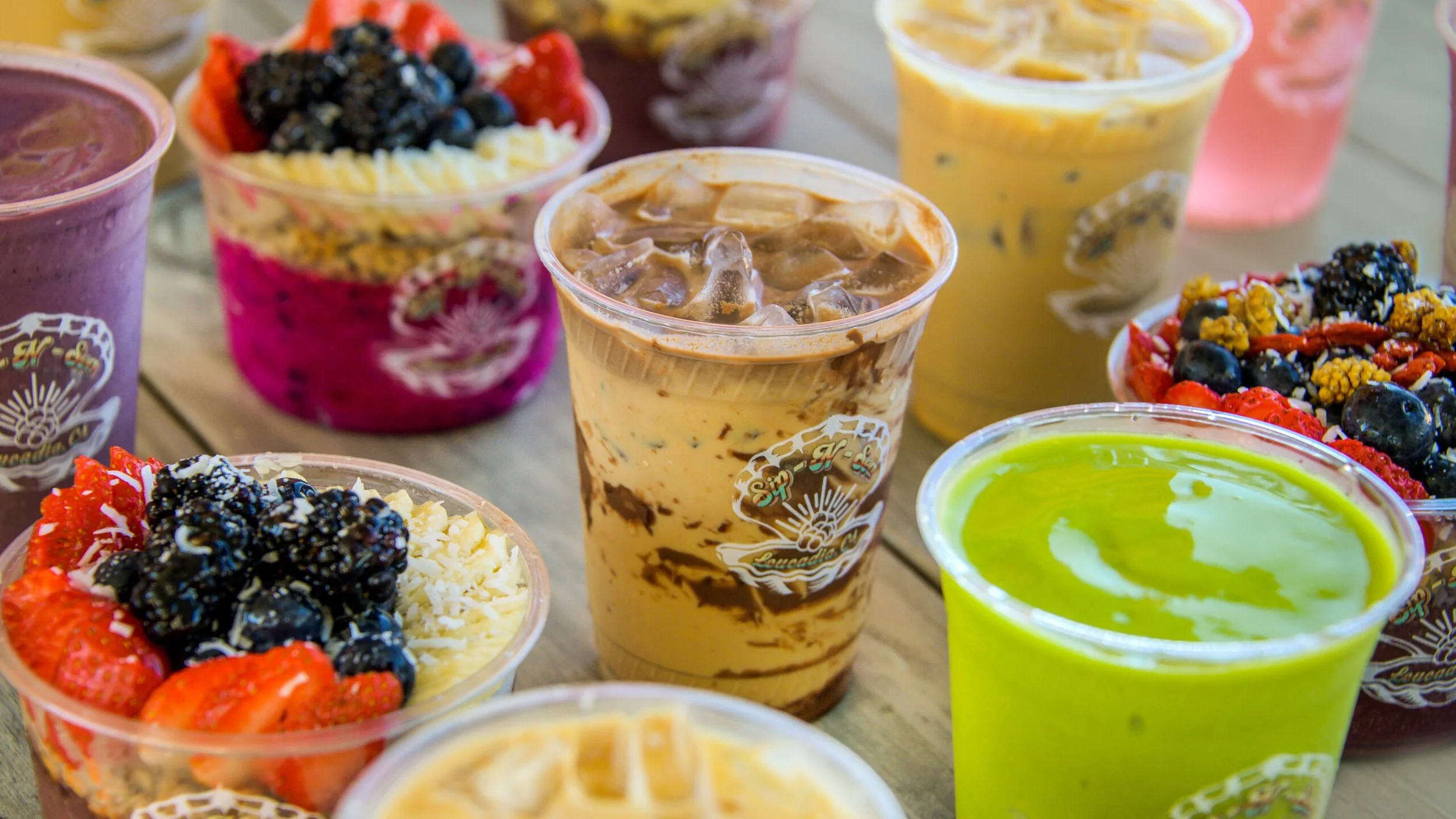 A tantalizing display of Sip-N-Sea's organic açaí bowls and refreshing drinks.