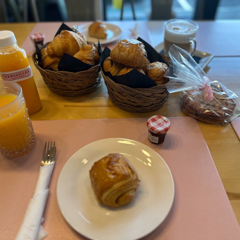 Experience the welcoming and authentic French vibe at Versailles Cafe.